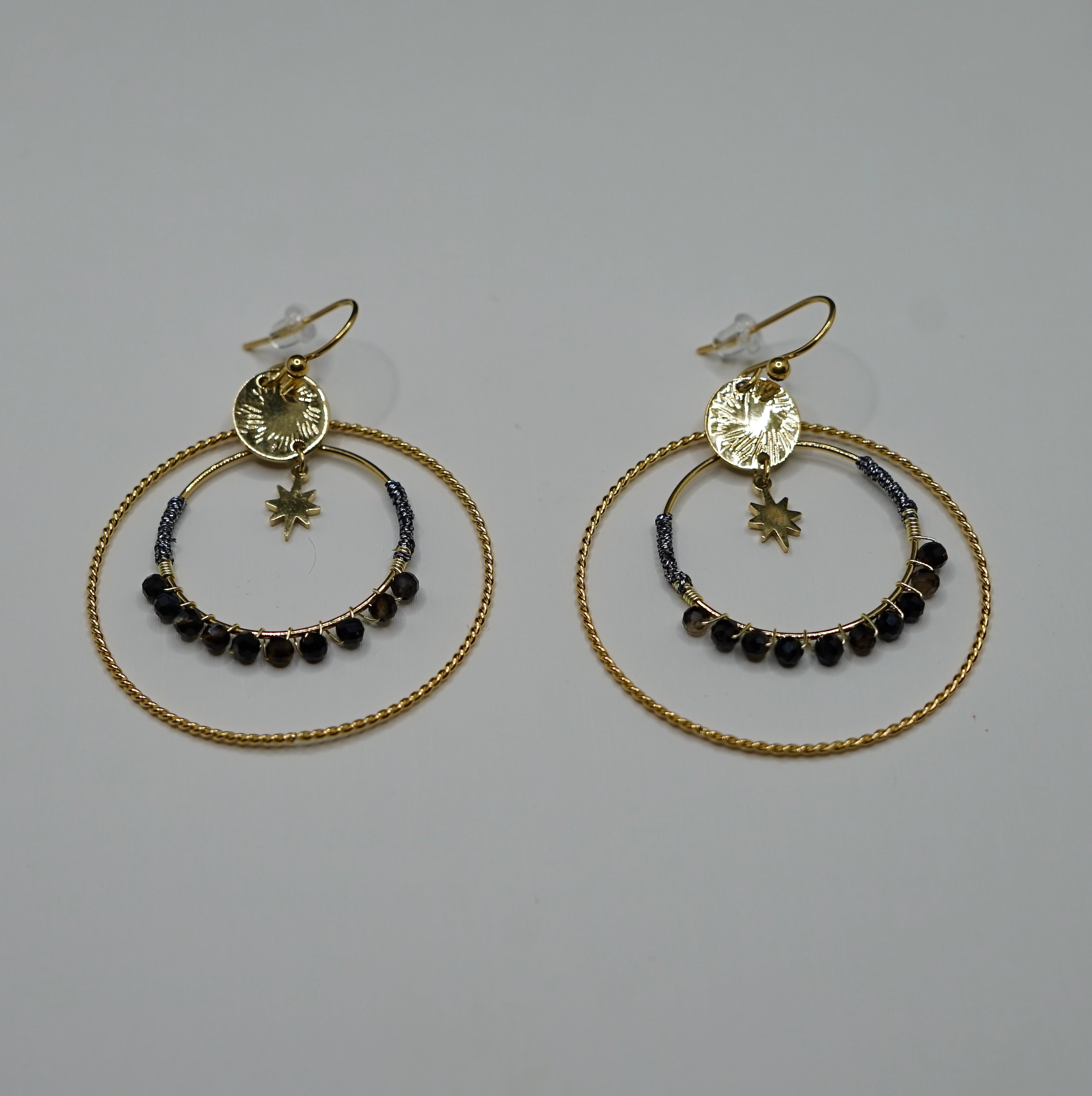 Boucle d'oreille XXX