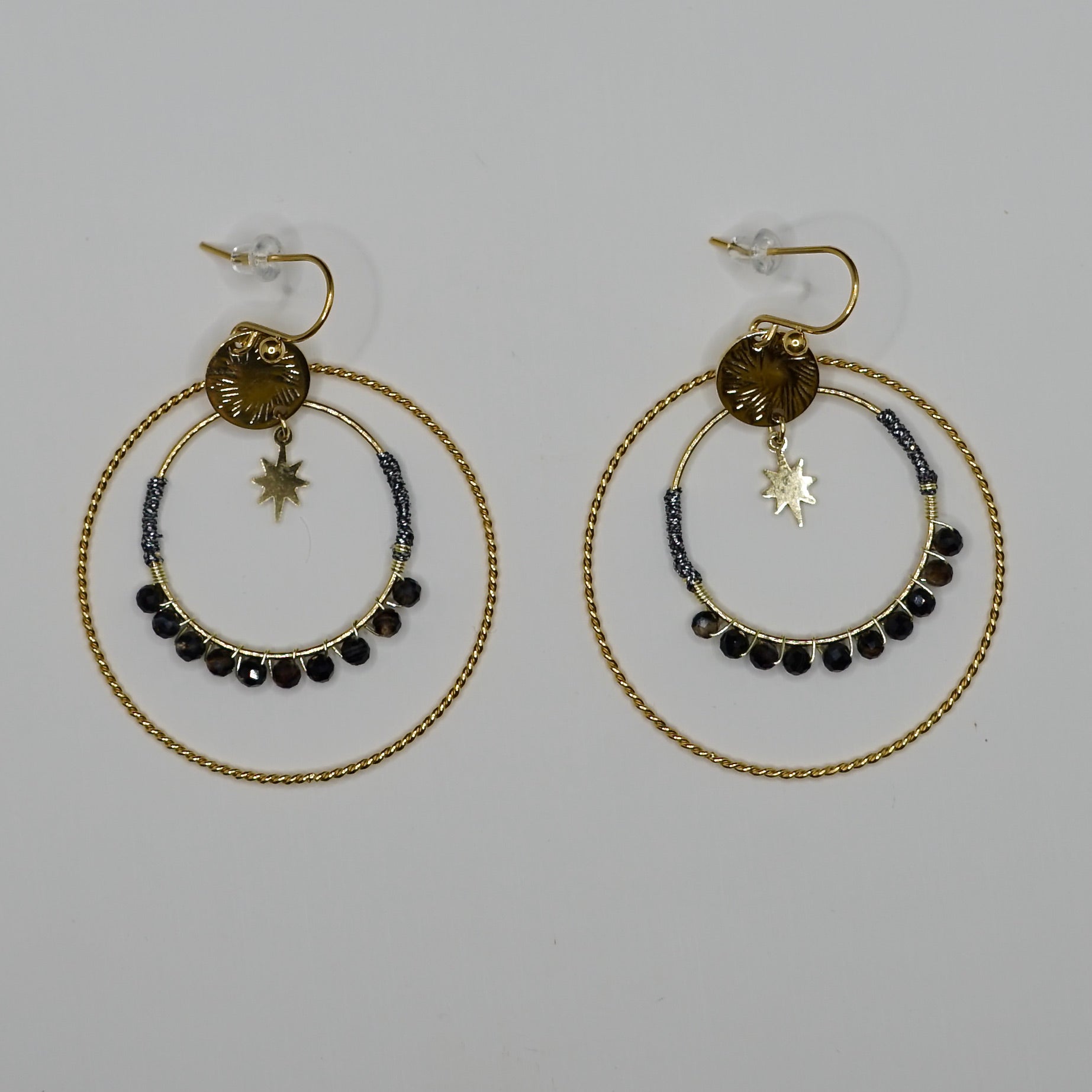 Boucle d'oreille XXX